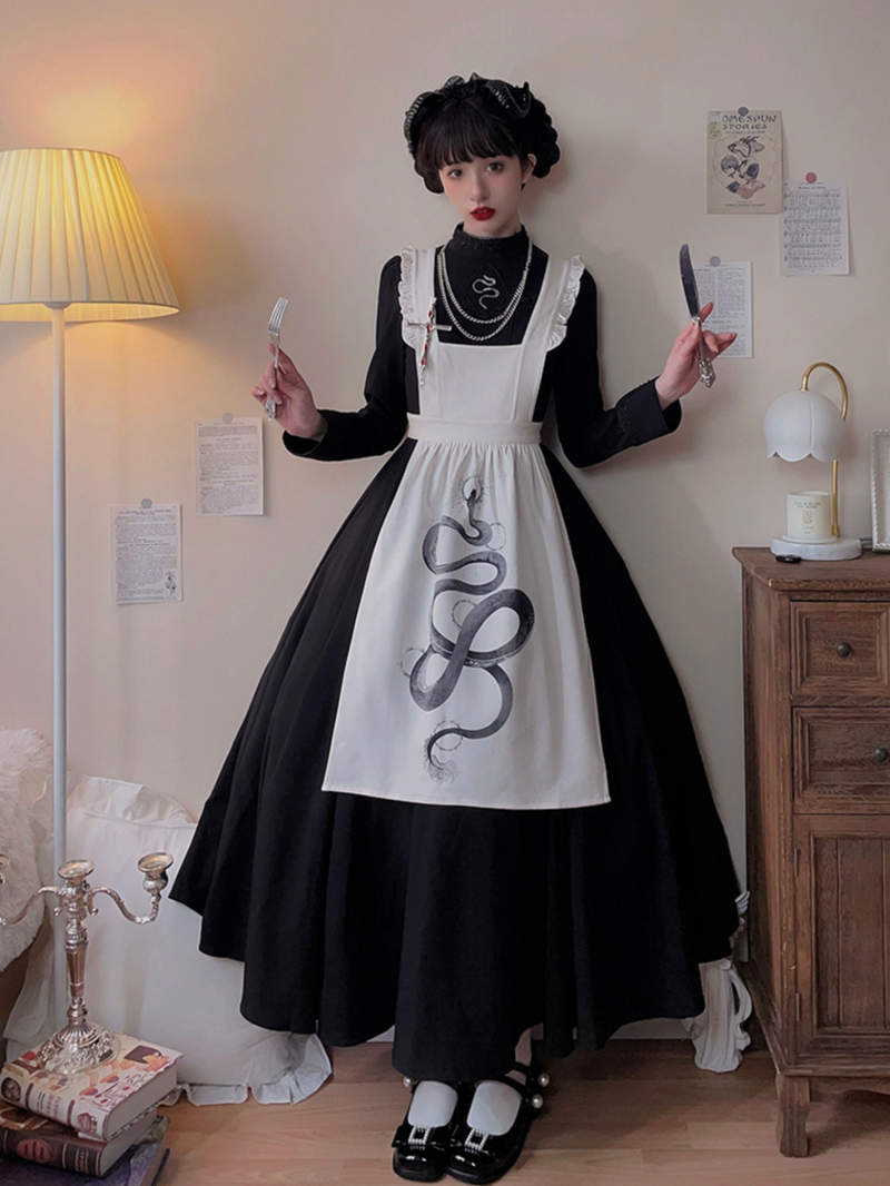 Black lady's embroidered classical dress and snake print apron