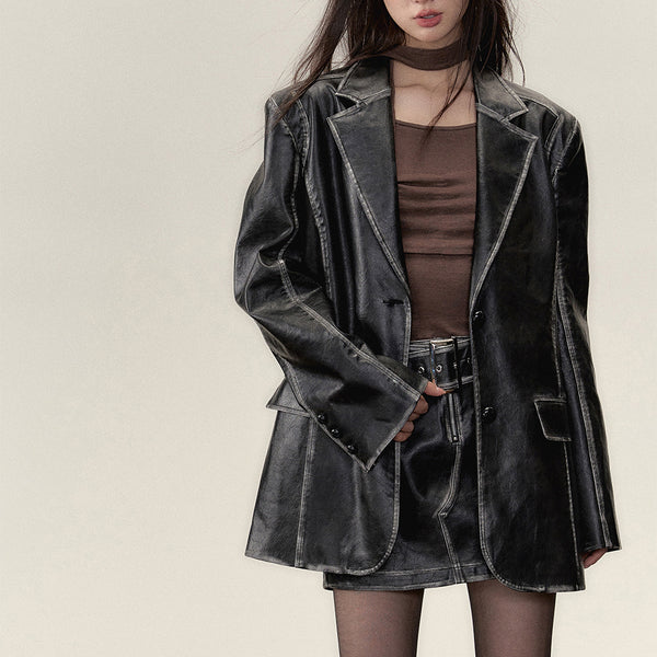 Black leather big silhouette jacket and short skirt