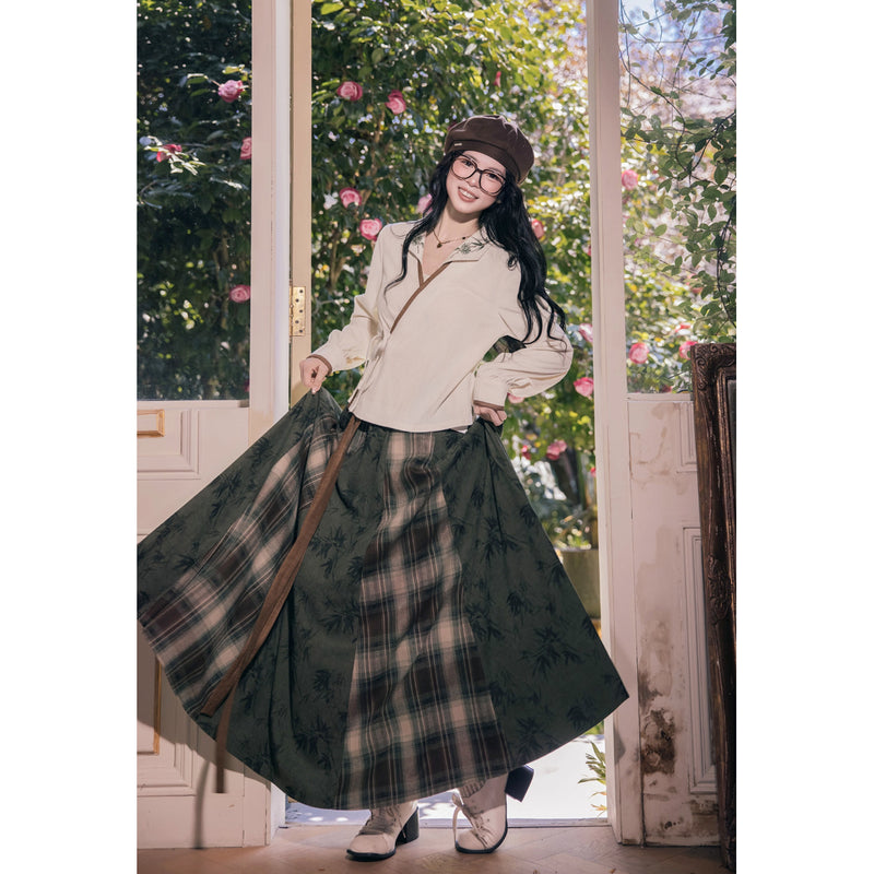 植物文様のニットベストとブラウスとスカート