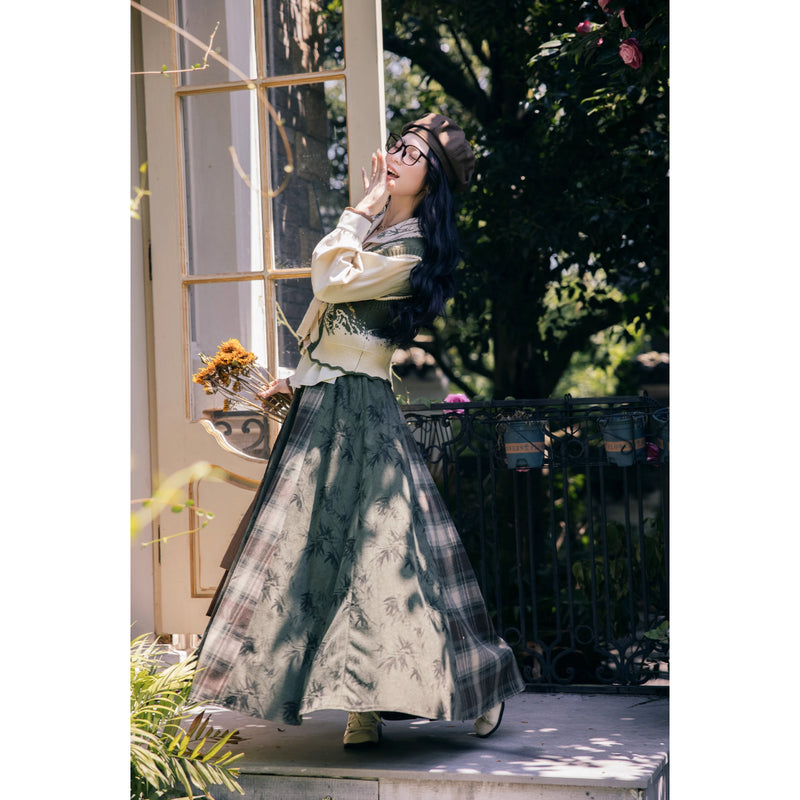 植物文様のニットベストとブラウスとスカート