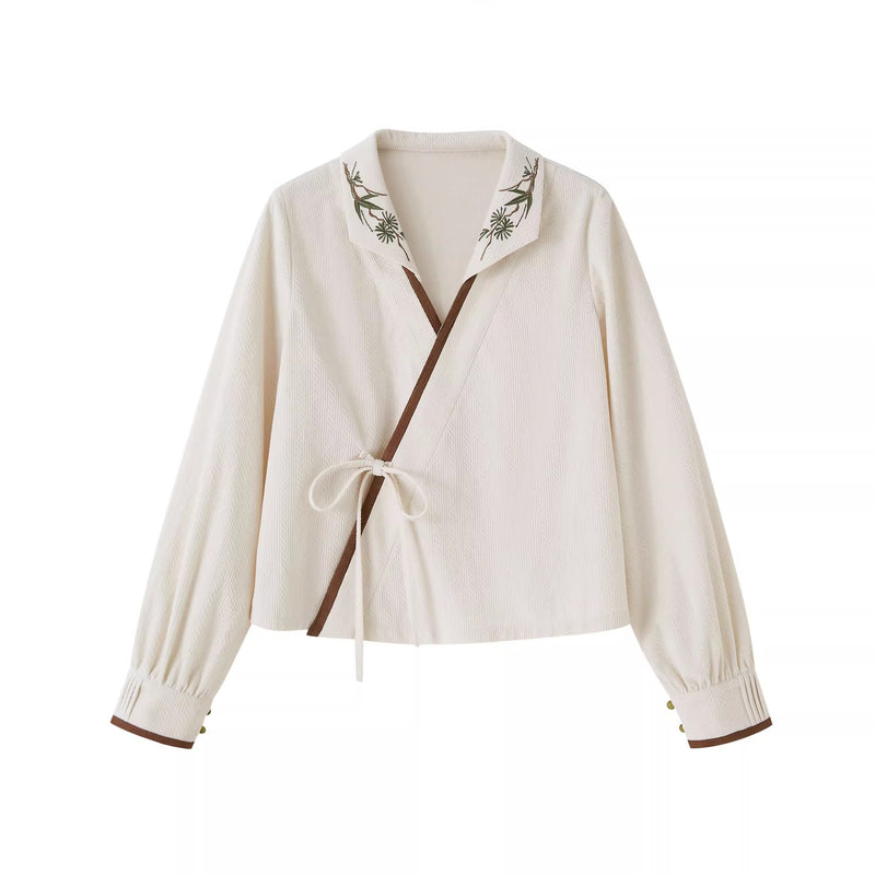 植物文様のニットベストとブラウスとスカート