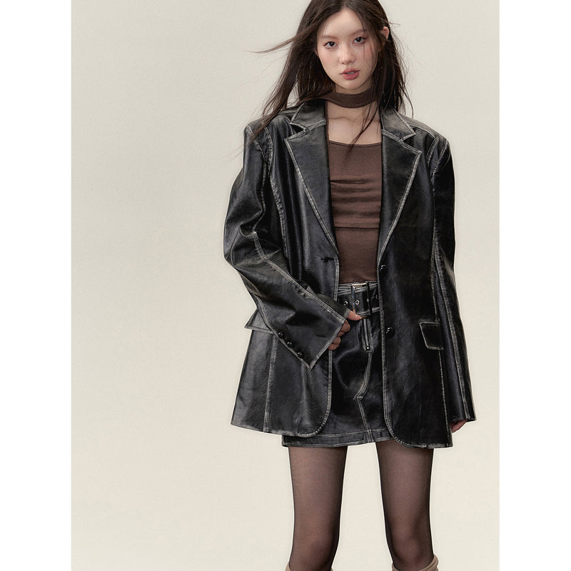 Black leather big silhouette jacket and short skirt