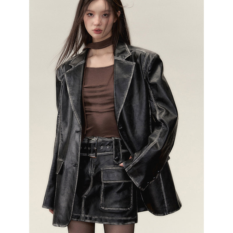 Black leather big silhouette jacket and short skirt