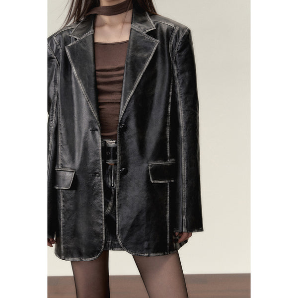 Black leather big silhouette jacket and short skirt