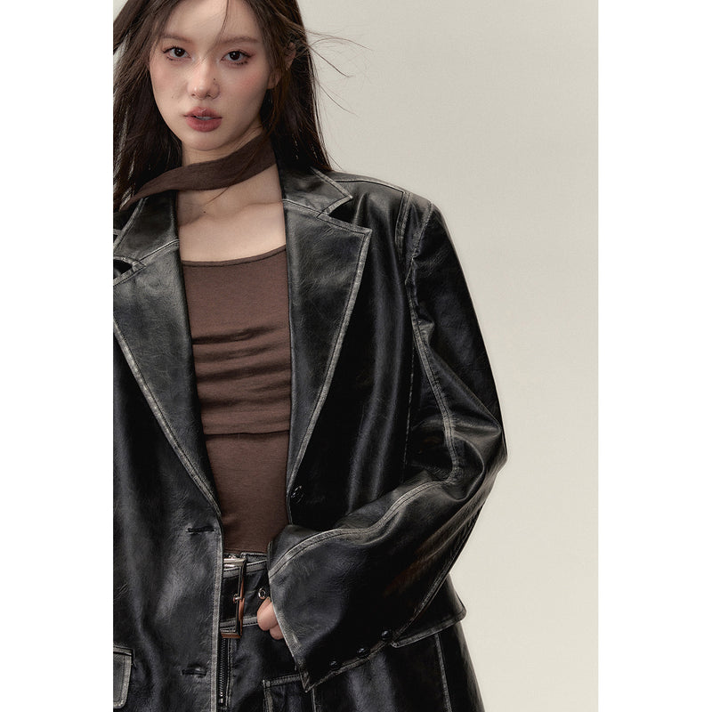 Black leather big silhouette jacket and short skirt