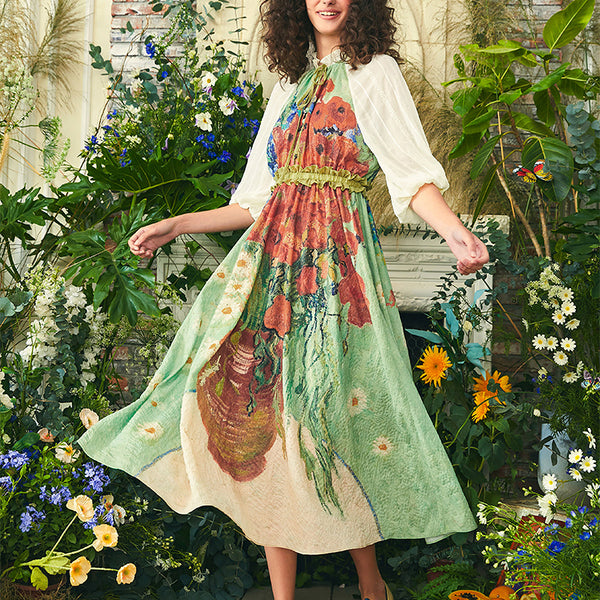 Long dress with daisies and poppies in a vase and cornflowers and poppies in a vase