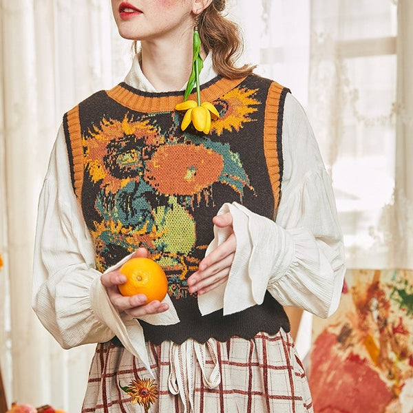 Knit vest with sunflowers and irises in a vase