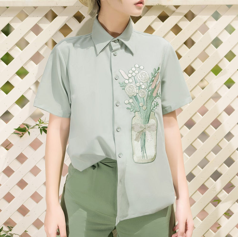 Embroidered shirt with a bouquet of flowers in a vase
