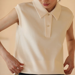 sand-colored lady sleeveless polo top