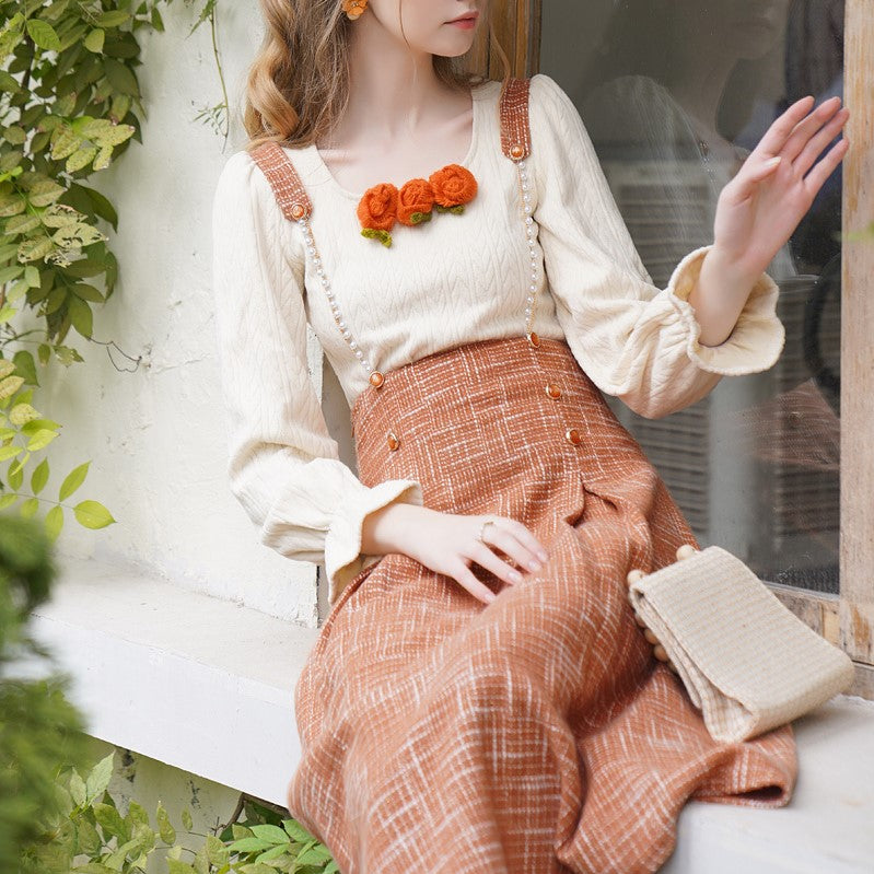 Orange blooming knit top and suspender skirt 