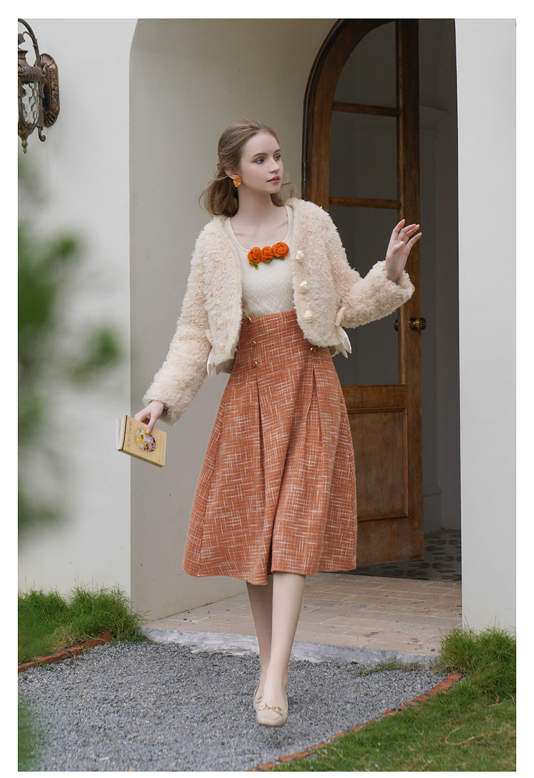 Orange blooming knit top and suspender skirt 