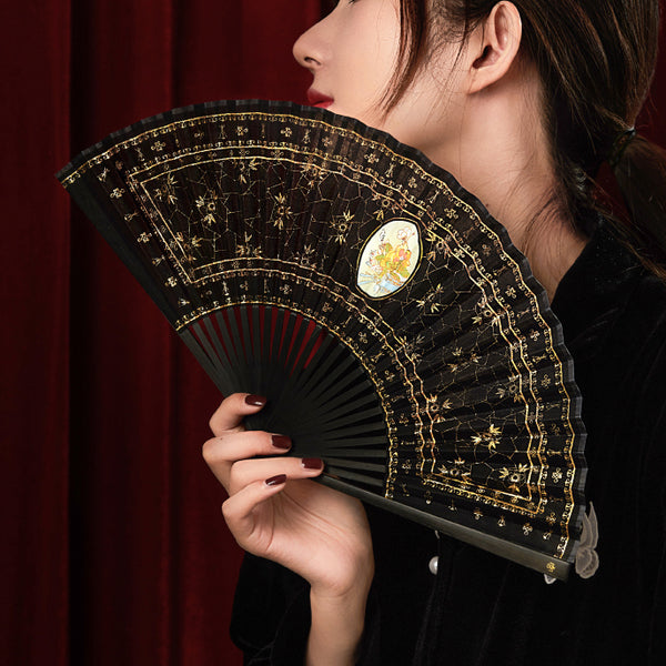 Gold fan with framed flower painting