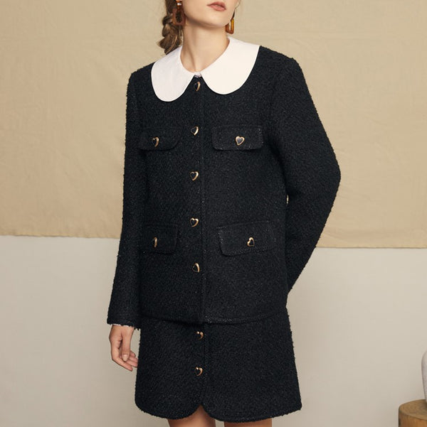 black lady's wool jacket and skirt
