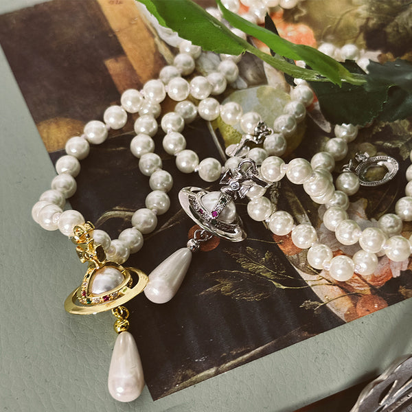 planet and pearl necklace