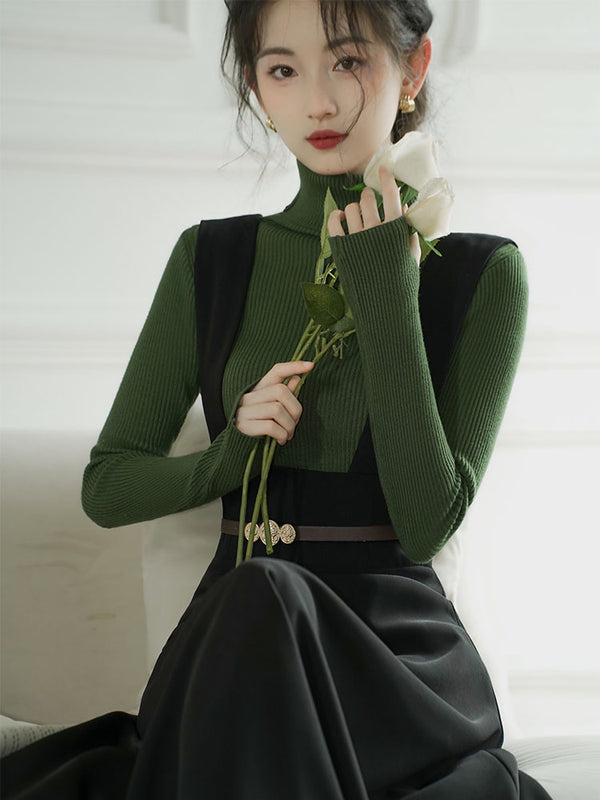 black lady strappy skirt and turtleneck sweater 