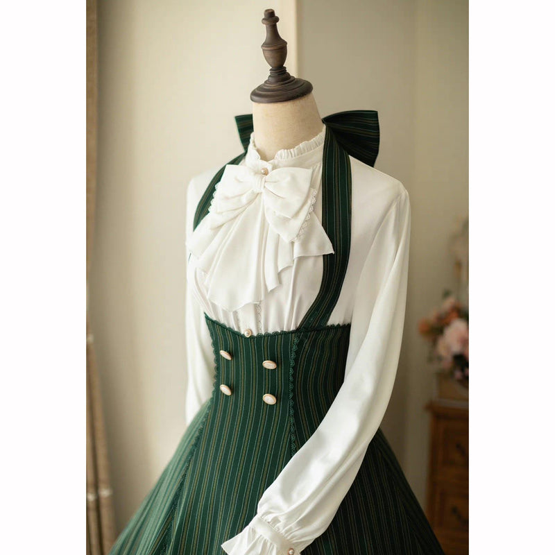 Dark green lady's vertical striped jumper skirt and high neck ribbon blouse
