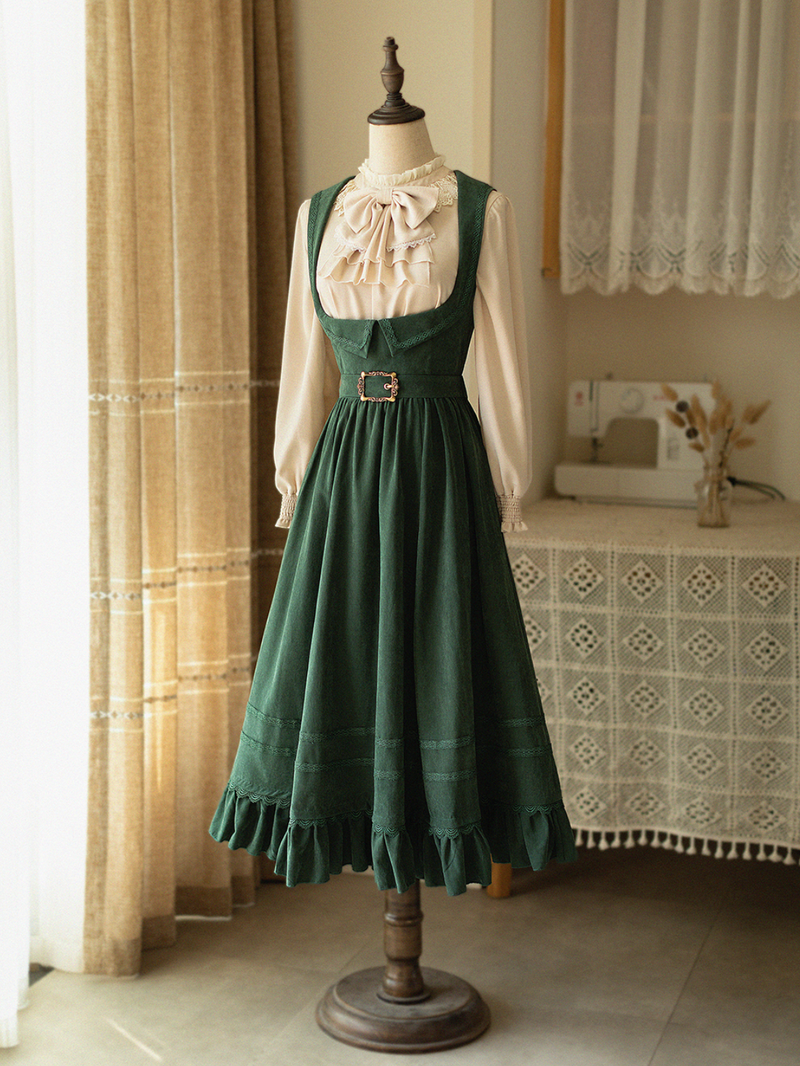 Dark green lady jumper skirt and high neck ribbon blouse
