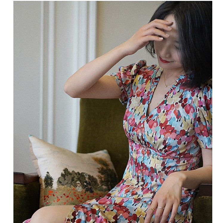Floral pattern vintage dress with colorful tropical flowers blooming