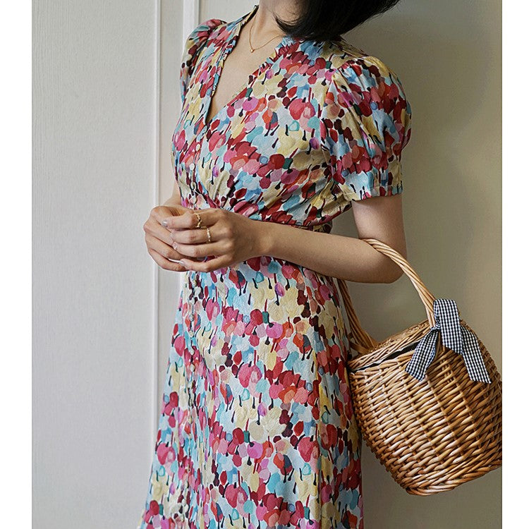 Floral pattern vintage dress with colorful tropical flowers blooming
