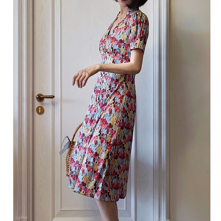 Floral pattern vintage dress with colorful tropical flowers blooming