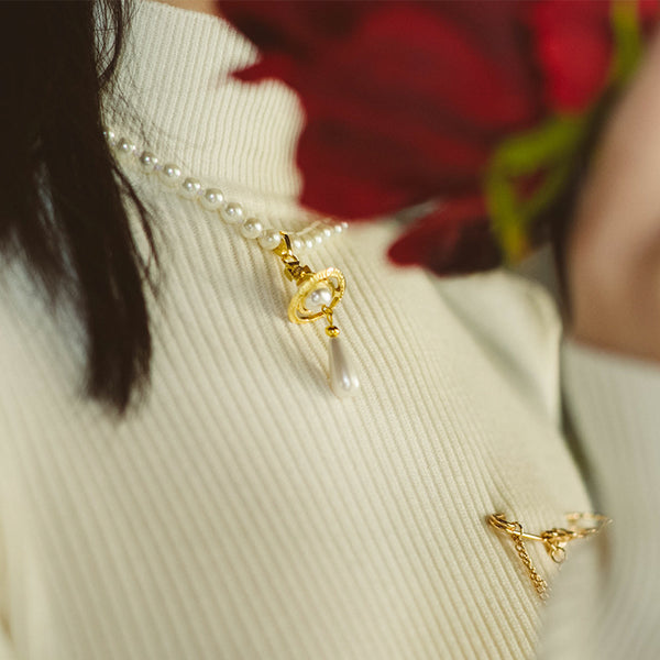 planet and pearl necklace