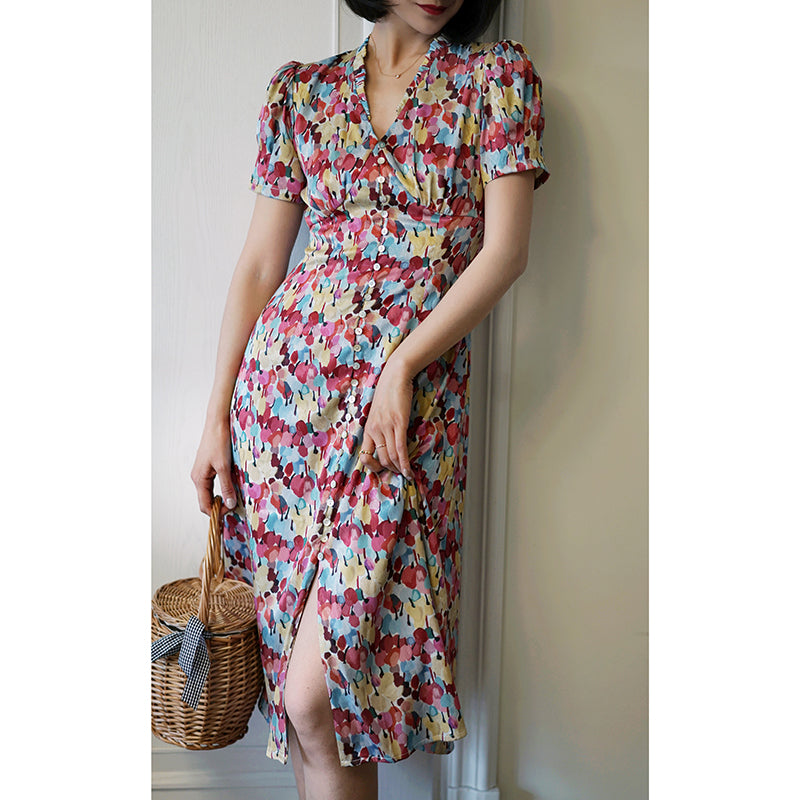 Floral pattern vintage dress with colorful tropical flowers blooming