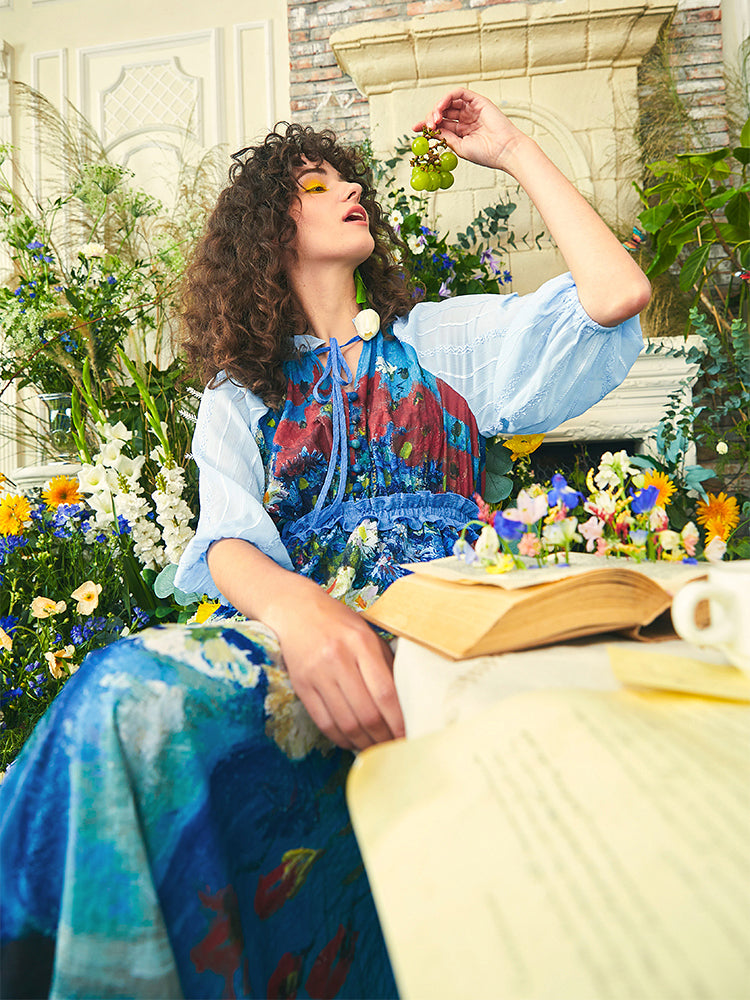 Long dress with daisies and poppies in a vase and cornflowers and poppies in a vase