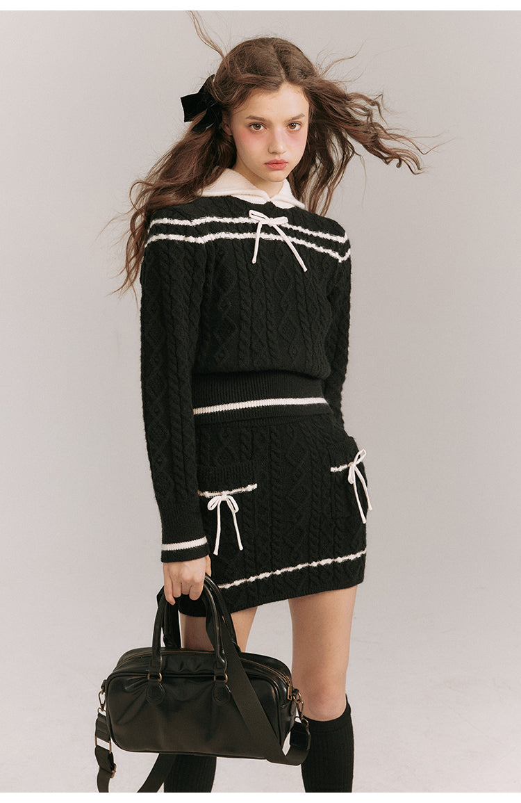 Black lady's ribbon knit sweater and knit skirt