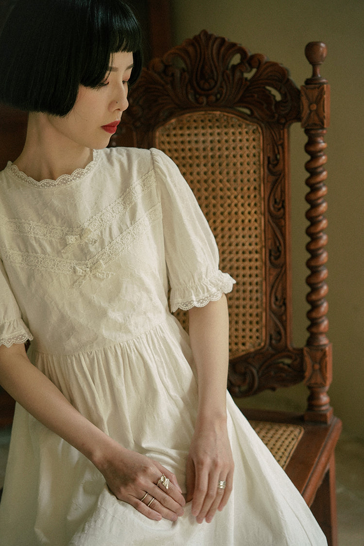 Embroidered retro dress of white lady