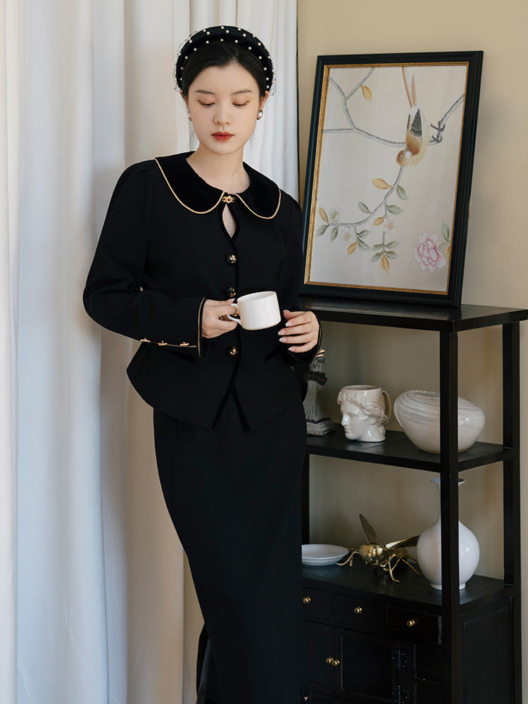Black lady's classic jacket and long skirt 