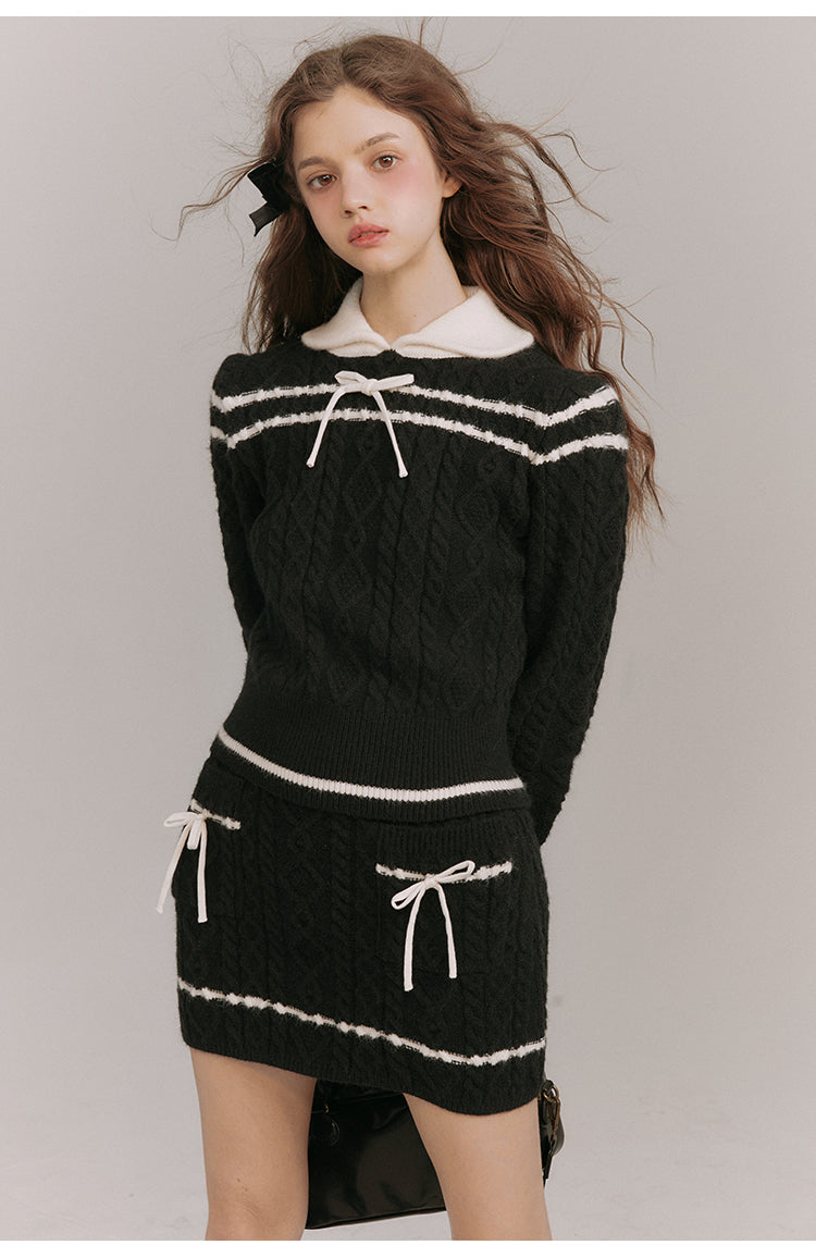 Black lady's ribbon knit sweater and knit skirt