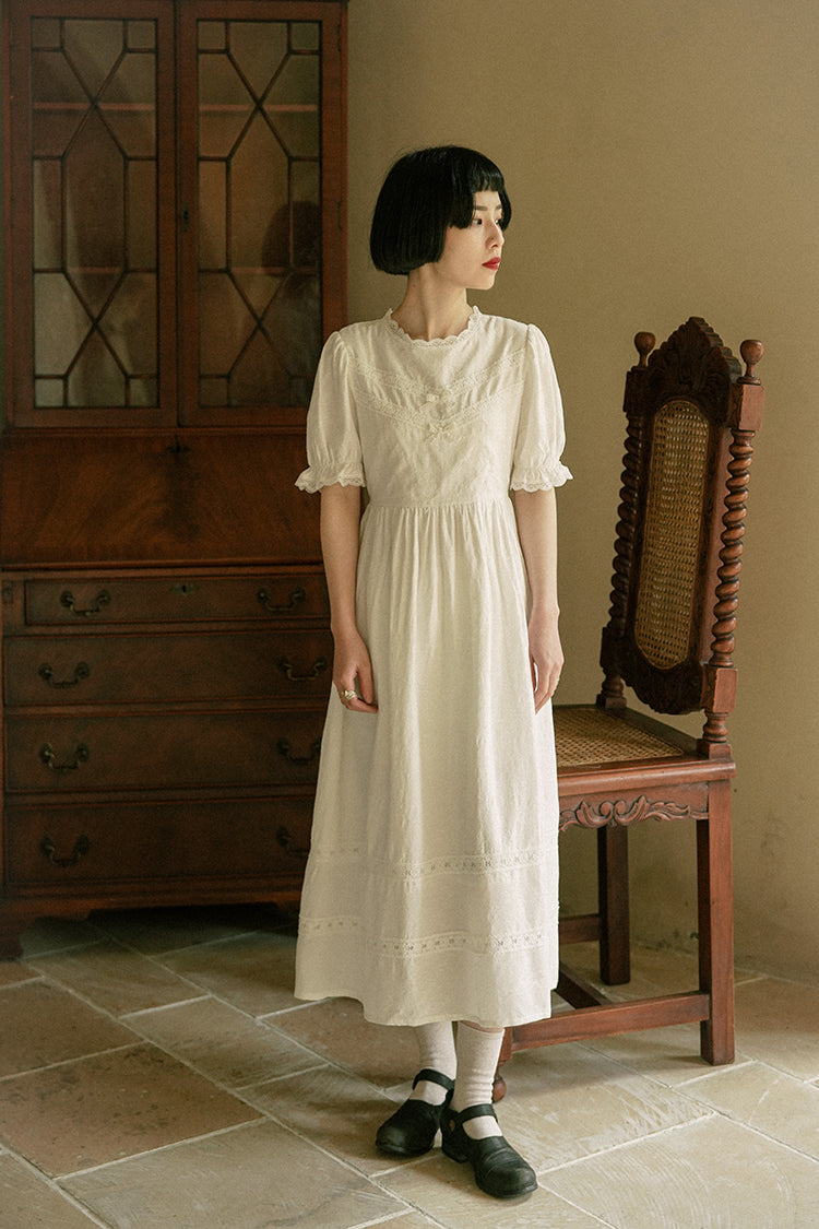 Embroidered retro dress of white lady
