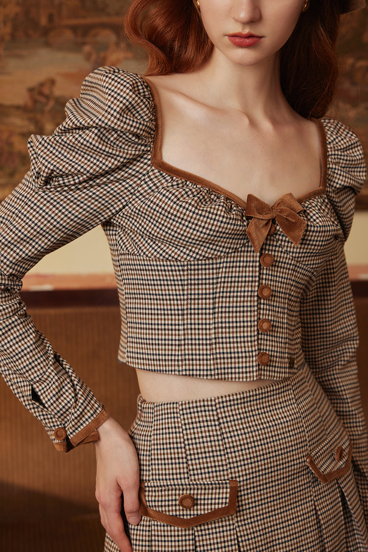 Queen's plaid top and pleated skirt