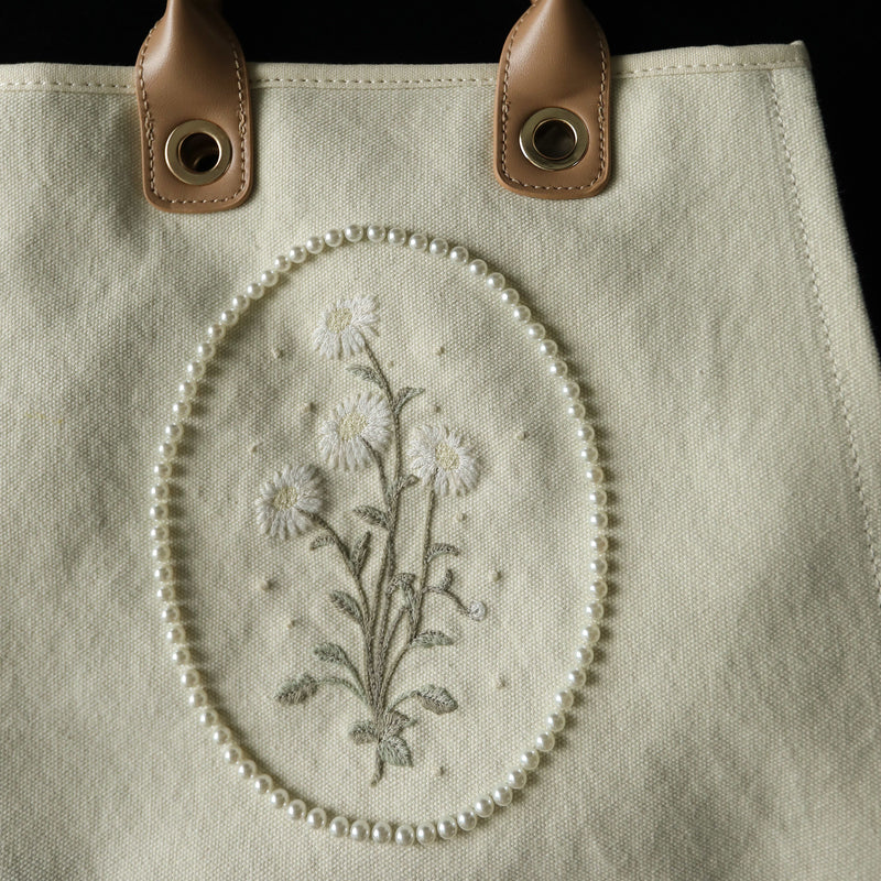 Embroidered pressed flower canvas tote bag