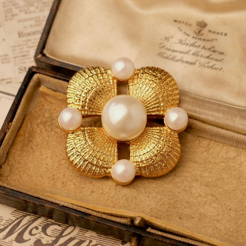 gold shell and pearl breastplate