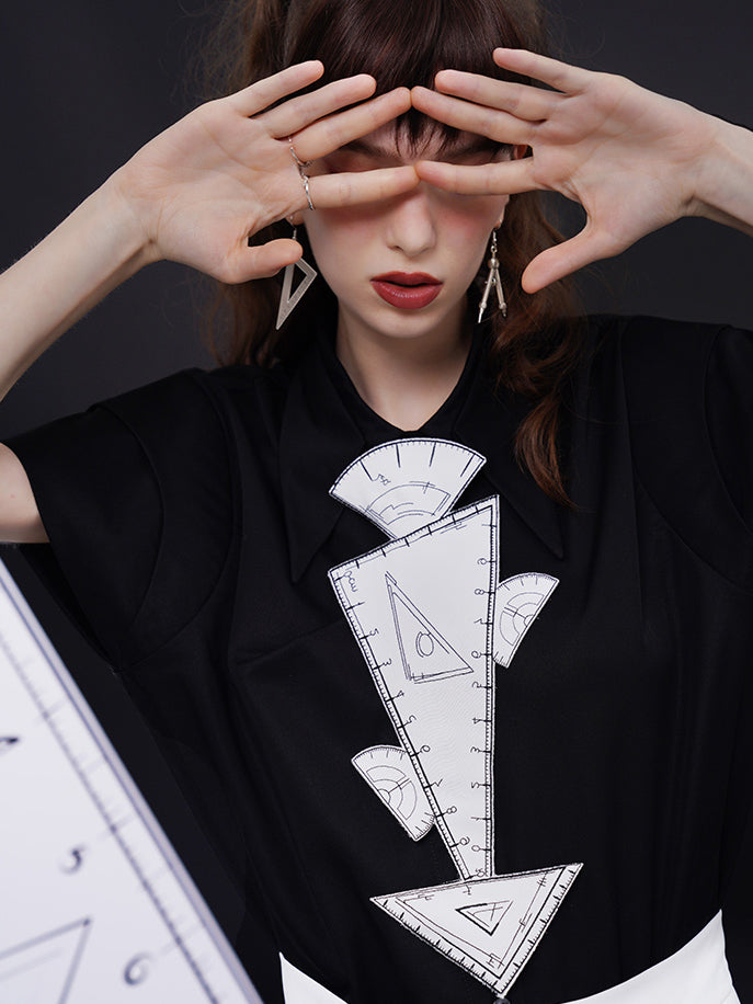 Geometric blouse with origami collar